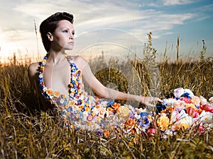 Fashion photo of beautiful lady in dress of flowers