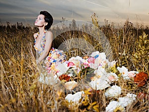 Fashion photo of beautiful lady in dress of flowers