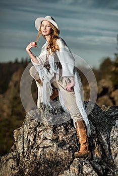 Fashion photo of beautiful woman at mountain photo