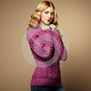 Fashion photo of beautiful woman in sweater