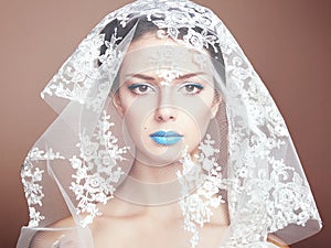 Fashion photo of beautiful women under white veil