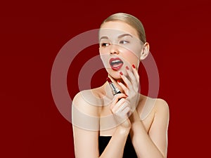 Fashion photo. Closeup of woman face with bright red matte lipstick on full lips. Beauty Cosmetics, Makeup Concept. A