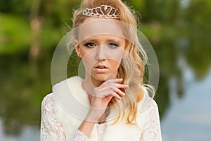 Fashion photo of a young girl in a beautiful white dress