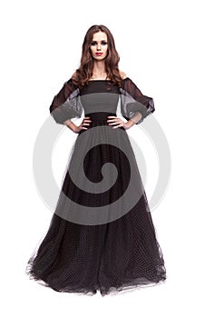 Fashion photo of young lady in elegant evening dress, on white background