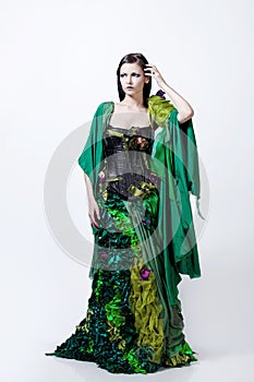 Fashion photo young magnificent woman in green