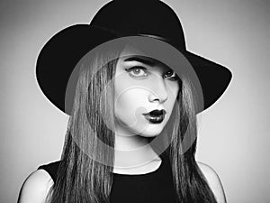 Fashion photo of young magnificent woman in hat. Girl posing