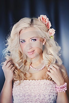 Fashion photo of a young woman with blond hair.