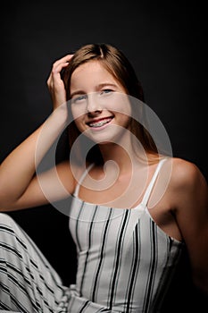 Fashion picture of beautiful girl wearing black and white clothing