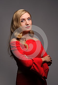 fashion picture of beautiful young blonde woman wearing red dress nice makeup