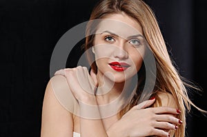 Fashion portrait of attractive young blonde woman with red lips