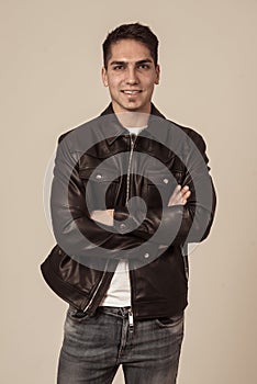 Fashion portrait of Attractive young mixed race man model posing in leather jacket
