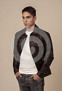 Fashion portrait of Attractive young mixed race man model posing in leather jacket