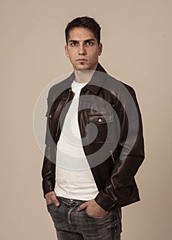 Fashion portrait of Attractive young mixed race man model posing in leather jacket
