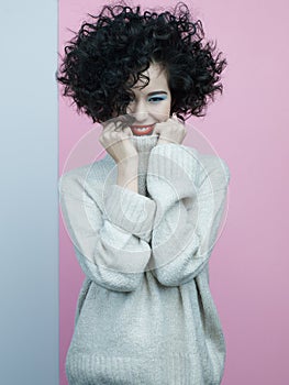 Fashion portrait of beautiful asian woman in oversize pullover