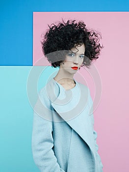 Fashion portrait of beautiful asian woman in sky-blue coat