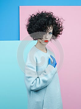 Fashion portrait of beautiful asian woman in sky-blue coat