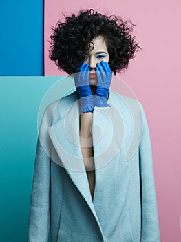 Fashion portrait of beautiful asian woman in sky-blue coat