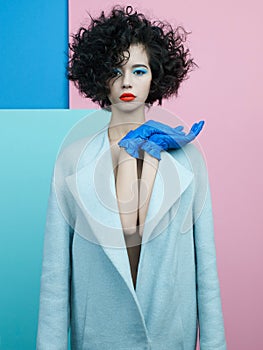 Fashion portrait of beautiful asian woman in sky-blue coat