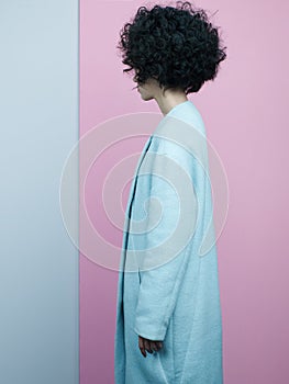 Fashion portrait of beautiful asian woman in sky-blue coat