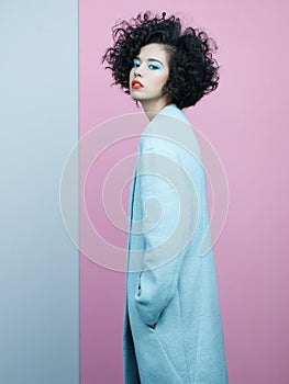 Fashion portrait of beautiful asian woman in sky-blue coat