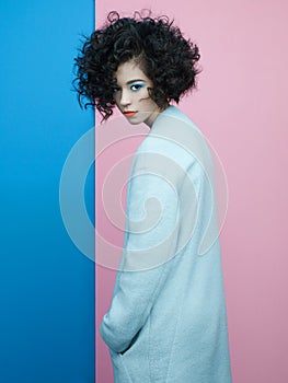 Fashion portrait of beautiful asian woman in sky-blue coat