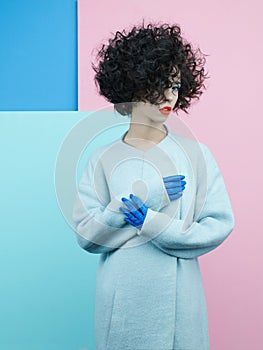 Fashion portrait of beautiful asian woman in sky-blue coat