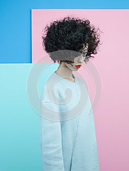 Fashion portrait of beautiful asian woman in sky-blue coat