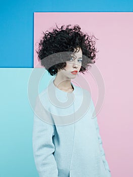 Fashion portrait of beautiful asian woman in sky-blue coat