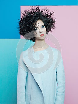 Fashion portrait of beautiful asian woman in sky-blue coat