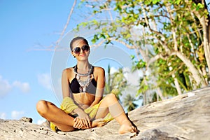 Fashion portrait of beautiful female model posing outdoor