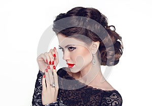Fashion Portrait Of Beautiful Girl with red nails and lips. Vogue Style Woman. Hairstyle