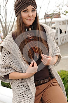 Fashion portrait of a beautiful smiling brunette woman