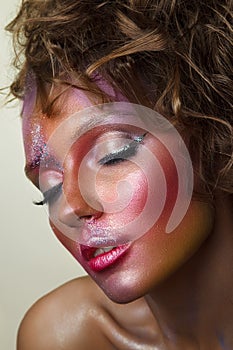Fashion portrait of beautiful woman. Creative colorful makeup wi