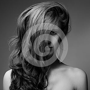 Fashion Portrait Of Beautiful Woman. Curly Long Hair. BW