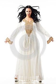 Fashion portrait of beautiful woman in elegant white dress