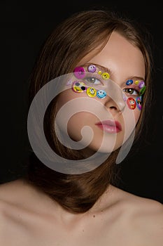 Fashion portrait of beautiful young model with stickers