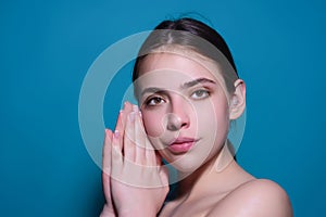 Fashion portrait of beautiful young model in studio. Fashionable woman with beauty face, soft skin, natural makeup