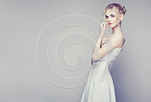 Fashion portrait of beautiful young woman with blond hair