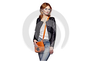 Fashion portrait of beautiful young woman with handbag