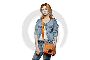 Fashion portrait of beautiful young woman with handbag photo