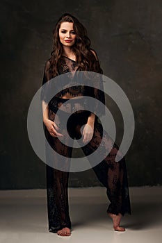 Fashion portrait of brunette woman in lace clothes