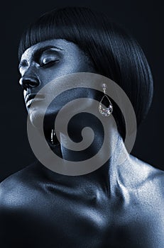Fashion portrait of a dark-skinned girl with jewerly. Black Beau