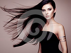 Fashion portrait of elegant woman with magnificent hair