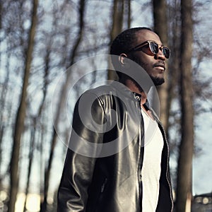 Fashion portrait of handsome african man in black leather jacket