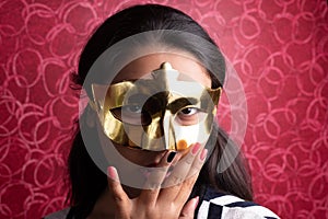 Fashion portrait of an Indian Bengali beautiful and young girl in western dress wearing an eye mask