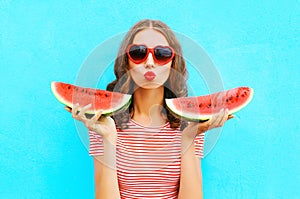 Fashion portrait pretty woman is holding slice of watermelon and