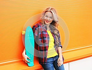 Fashion portrait of pretty young woman in red checkered hipster