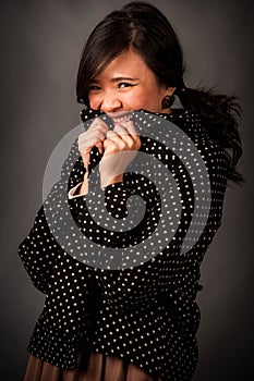 Fashion portrait in studio of beautiful young asian smiling woman feeling happy in success life