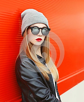 Fashion portrait stylish woman wearing a rock black leather jacket and sunglasses