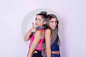 Fashion portrait of two caucasian women posing. Friendship conce